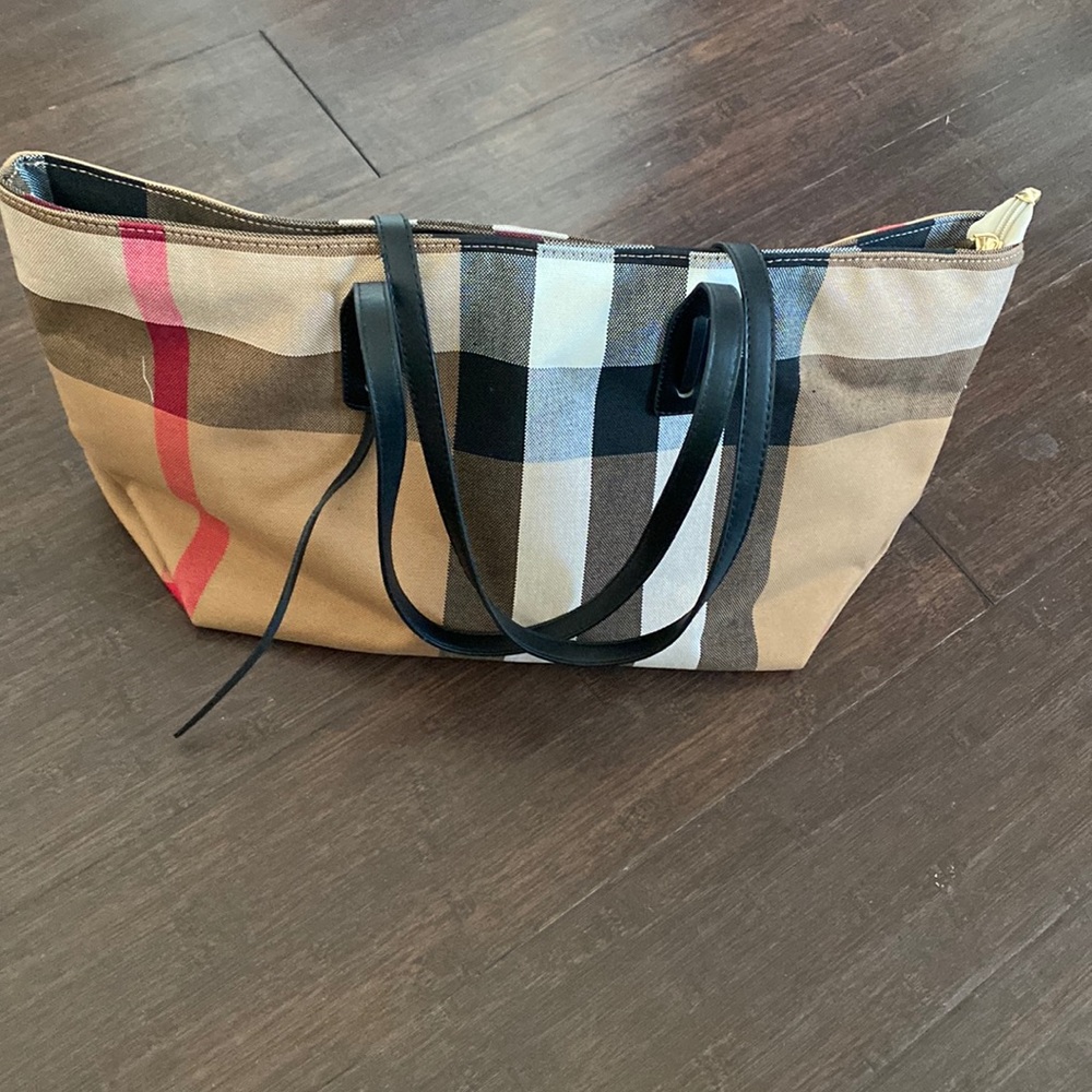 Brand new. Never used. Canvas material tote bag